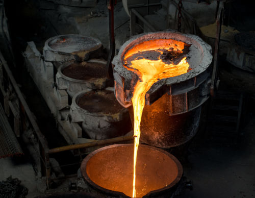 Tank pours liquid metal at the steel mill