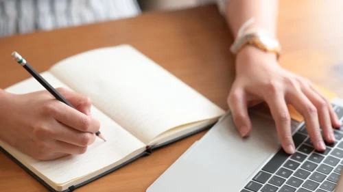 person-writing-at-computer_AdobeStock_263470667_2250x1500