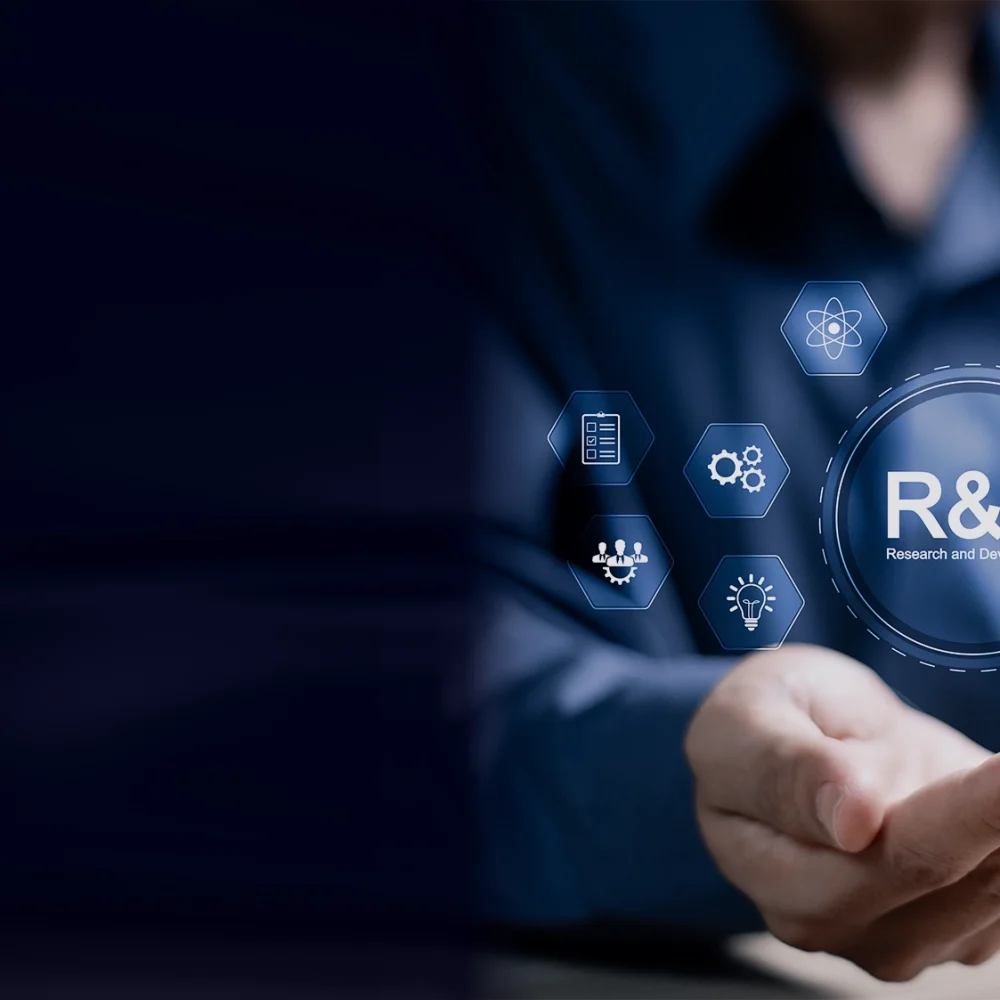 AdobeStock_792860353_man-holding-R&D-symbol_TC-Solutions-header