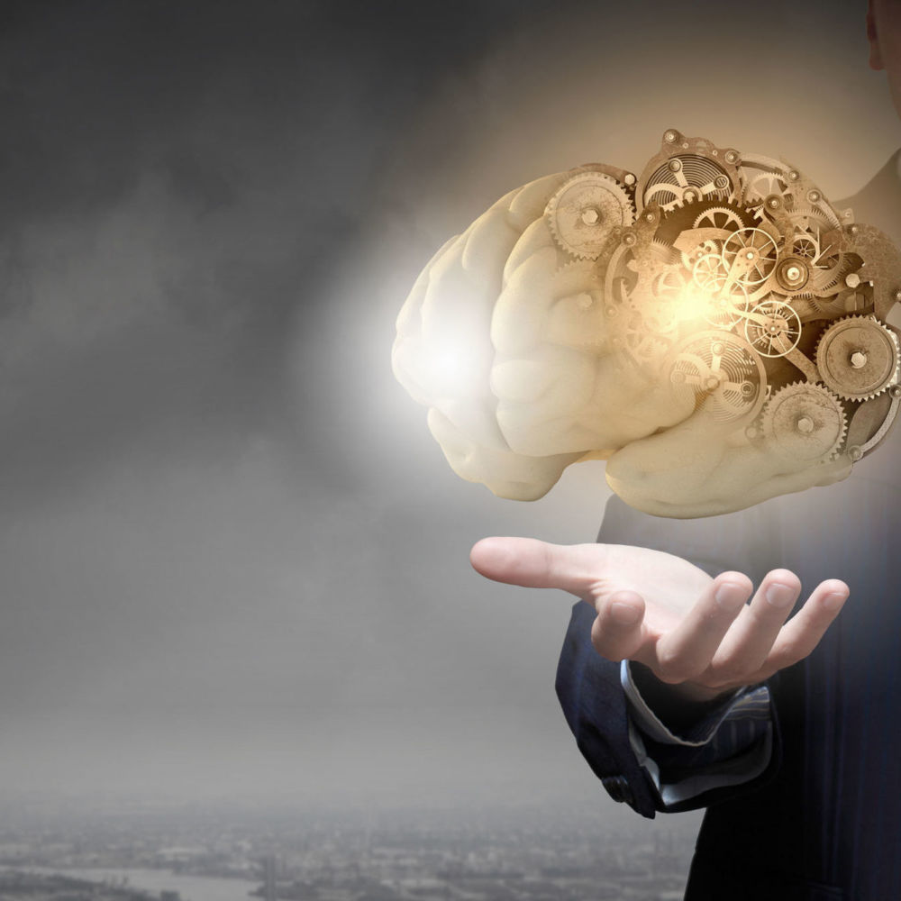 Man with a brain with cogs