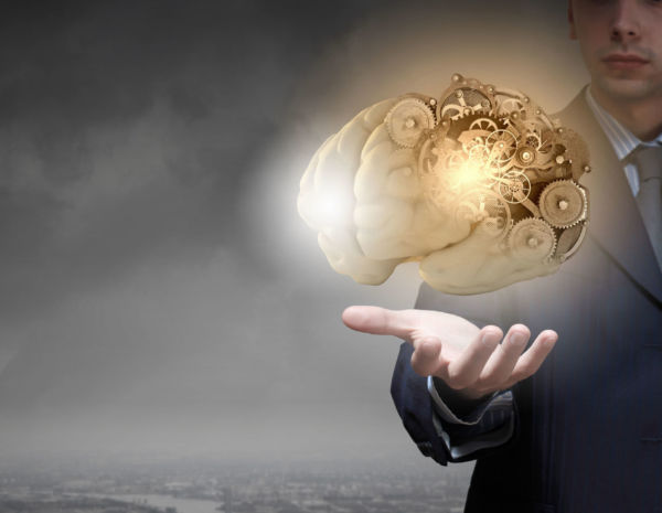 Man with a brain with cogs