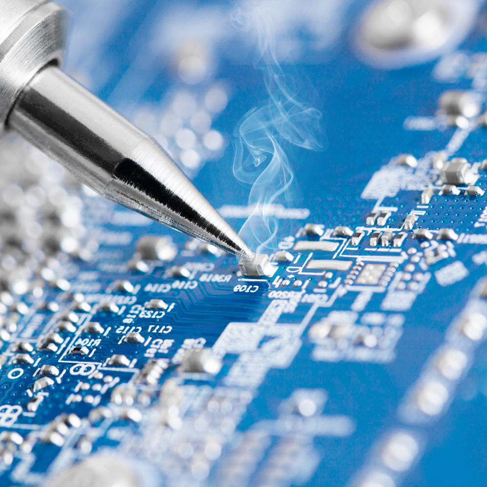 Microcircuit being fixed with soldering iron