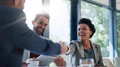 AdobeStock_602920660_people-smiling-and-shaking-hands_2248x1500