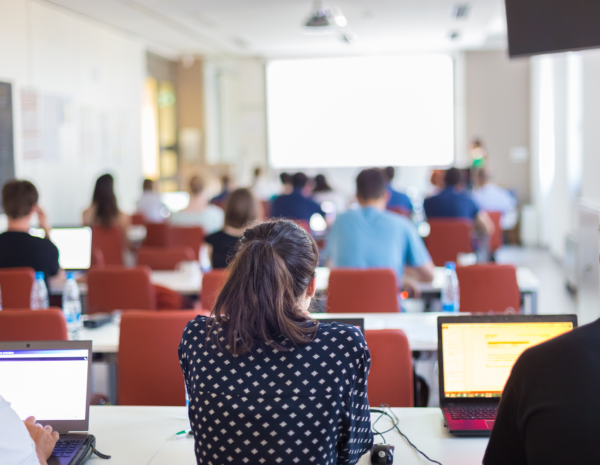 People in classroom with laptops