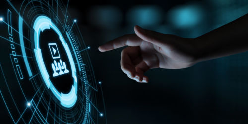 Hand about to press a futuristic play button.